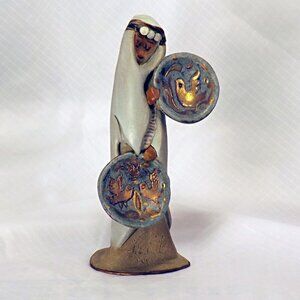 5 3/4" Ceramic Statue of a Woman in Native Dress W/Plates